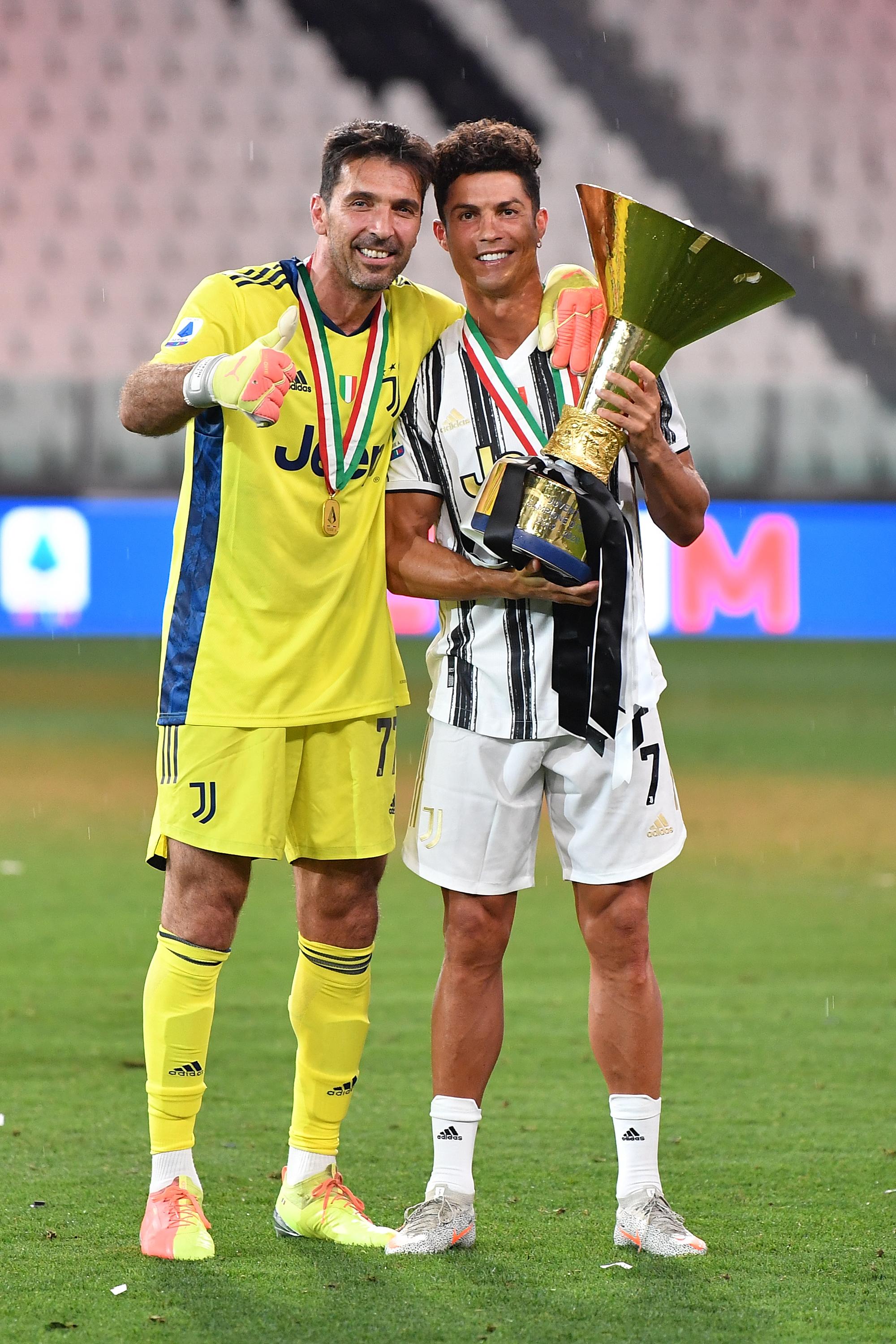 Cristiano Ronaldo( on the right) poses for a photo with Buffon ( on the left)